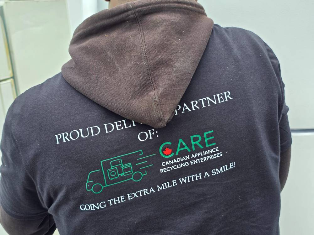 CARE team member in branded hoodie - Proud Delivery Partner